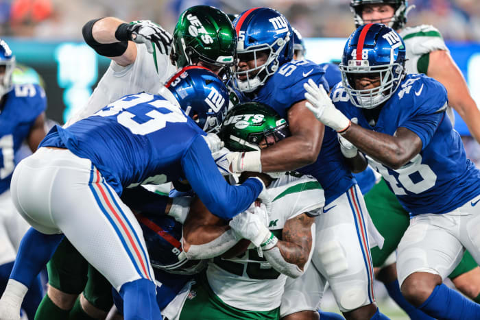 Jets running back Ty Johnson (25) is tackled by New York Giants linebackers Trent Harris (93) and Tae Crowder (48). Mandatory Credit: Vincent Carchietta-USA TODAY